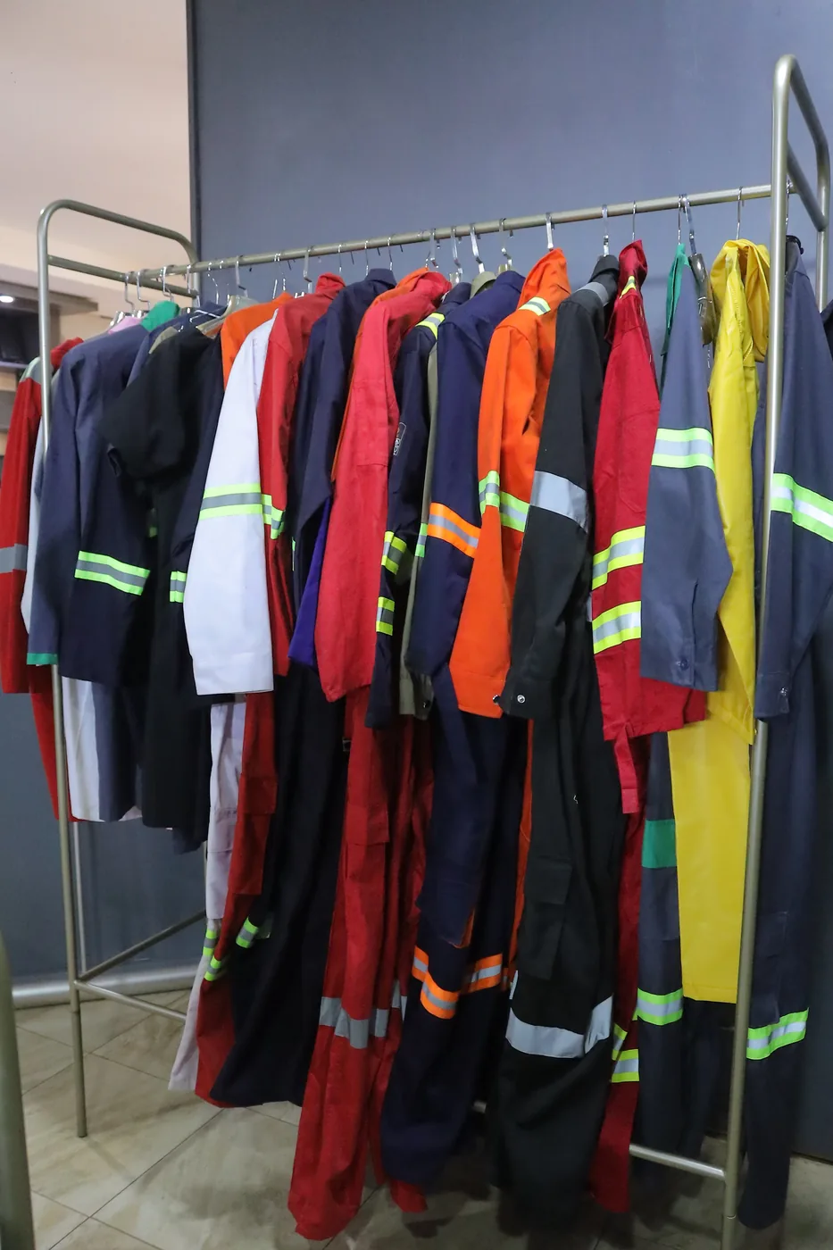 Several reflective-overall colours displayed on a rack